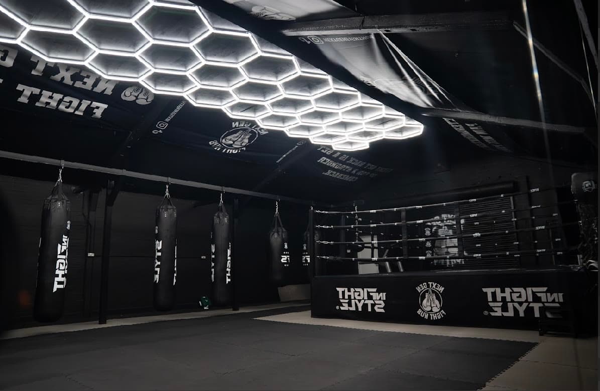 Heavy bag row running the length of the gym beside the ring