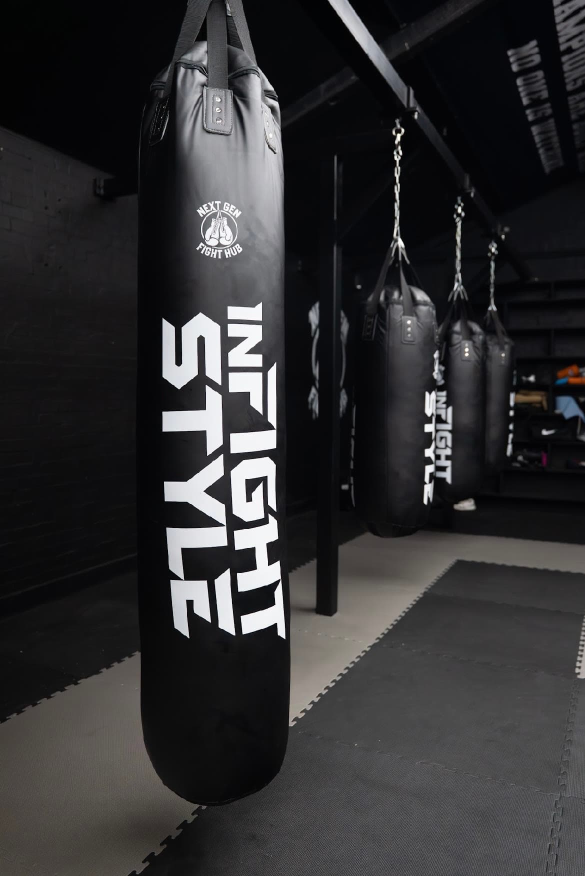 Next Gen branded heavy bags hanging in a row