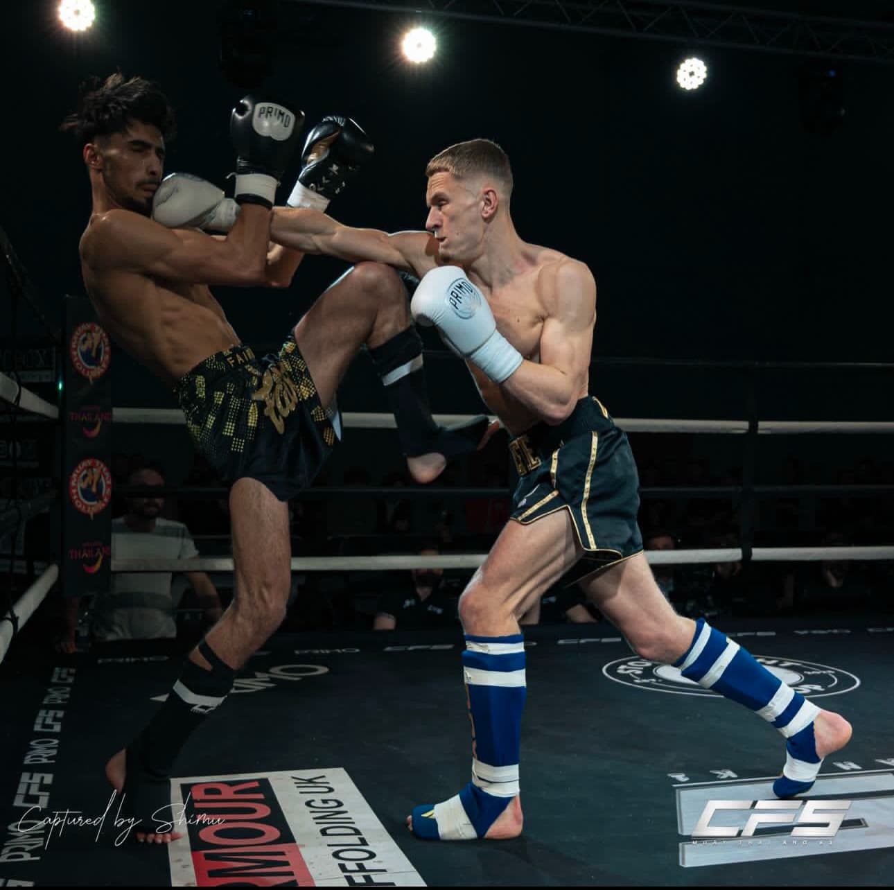 A Next Gen fighter exchanging in the ring in competition